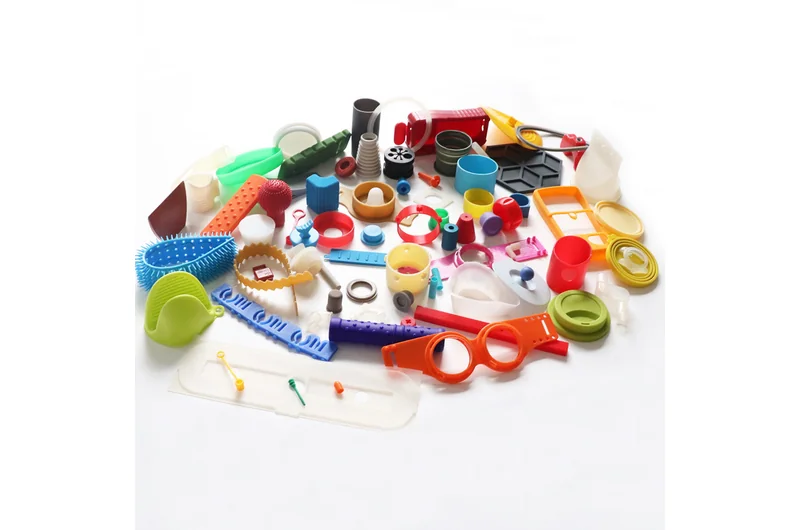 Colorful molded parts including rings sleeves caps and straps